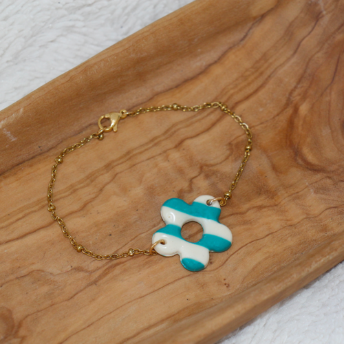 bracelet pampille fleur raye bleu turquoise acier inoxydable dore