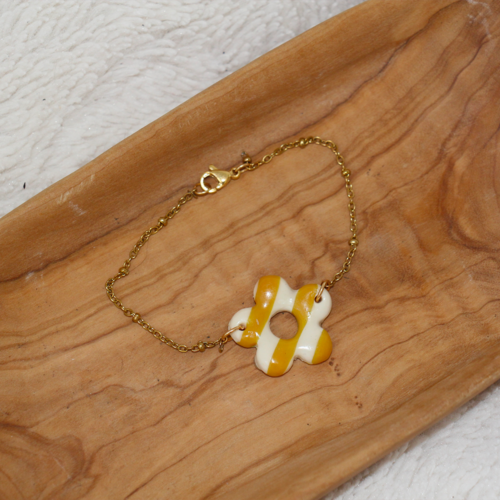 bracelet pampille fleur raye jaune et blanc acier inoxydable dore